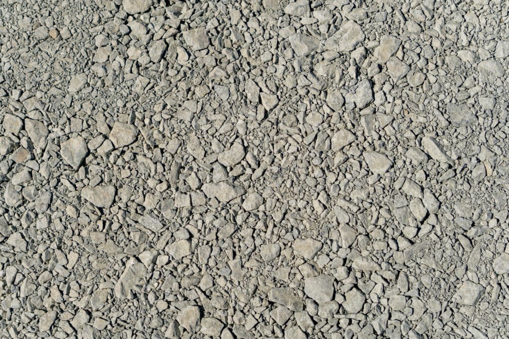 A closeup of a gravel surface that contains a wide variety of sizes, from 1-1/4