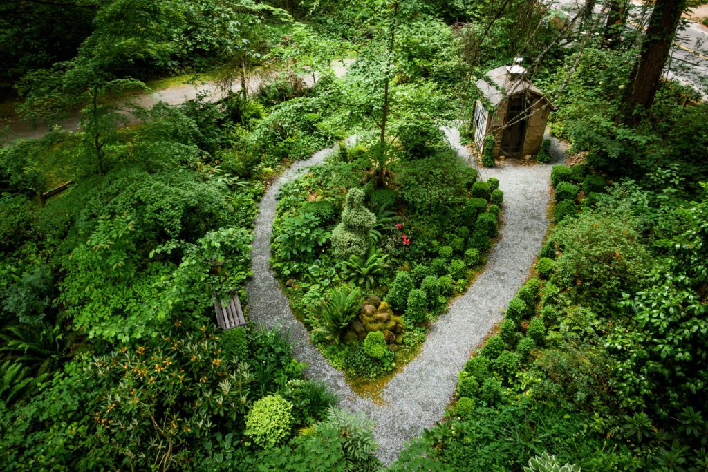 aerial view of a path wrapping around a topiary garden