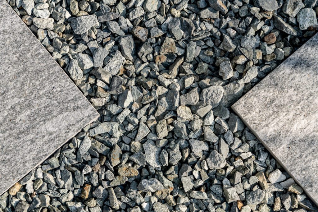 gravel between the points of two square stepping stones