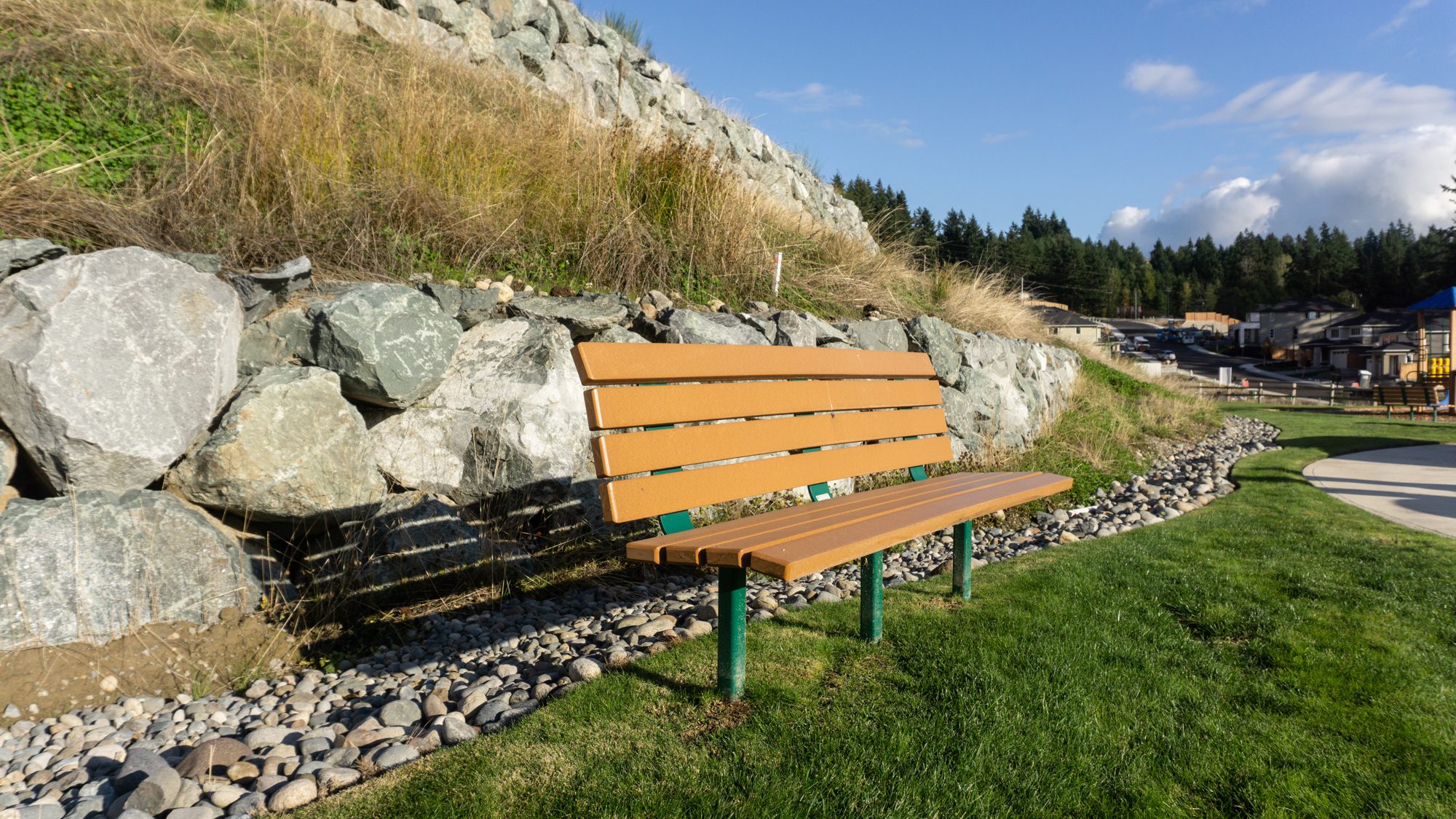 bench in front of rock wall