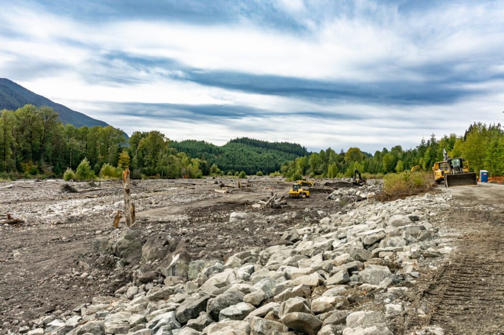 construction equipment working along the Nisqually River levee