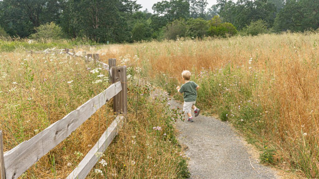 child running on path of Naches Trail Preserve