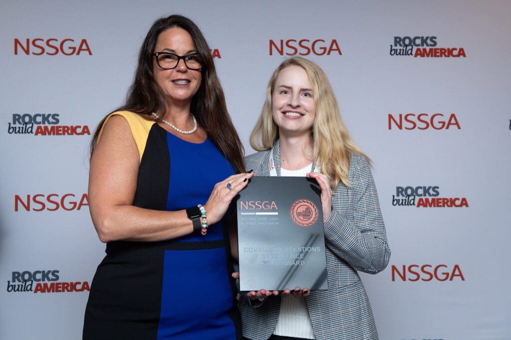 two people posing with an award