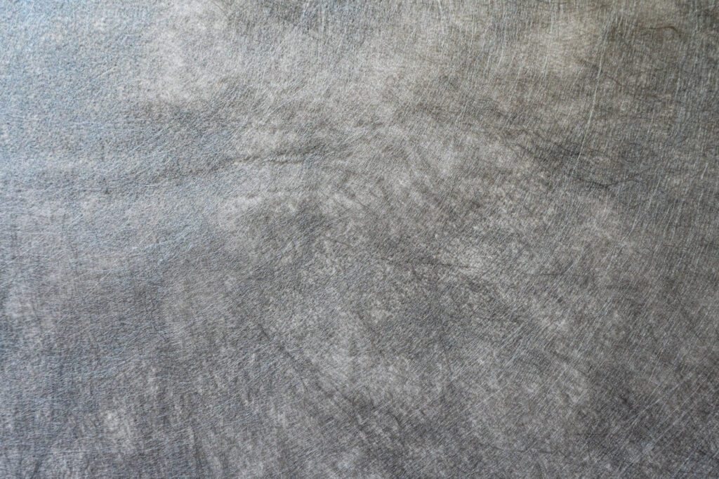 closeup of a piece of gray nonwoven landscape fabric