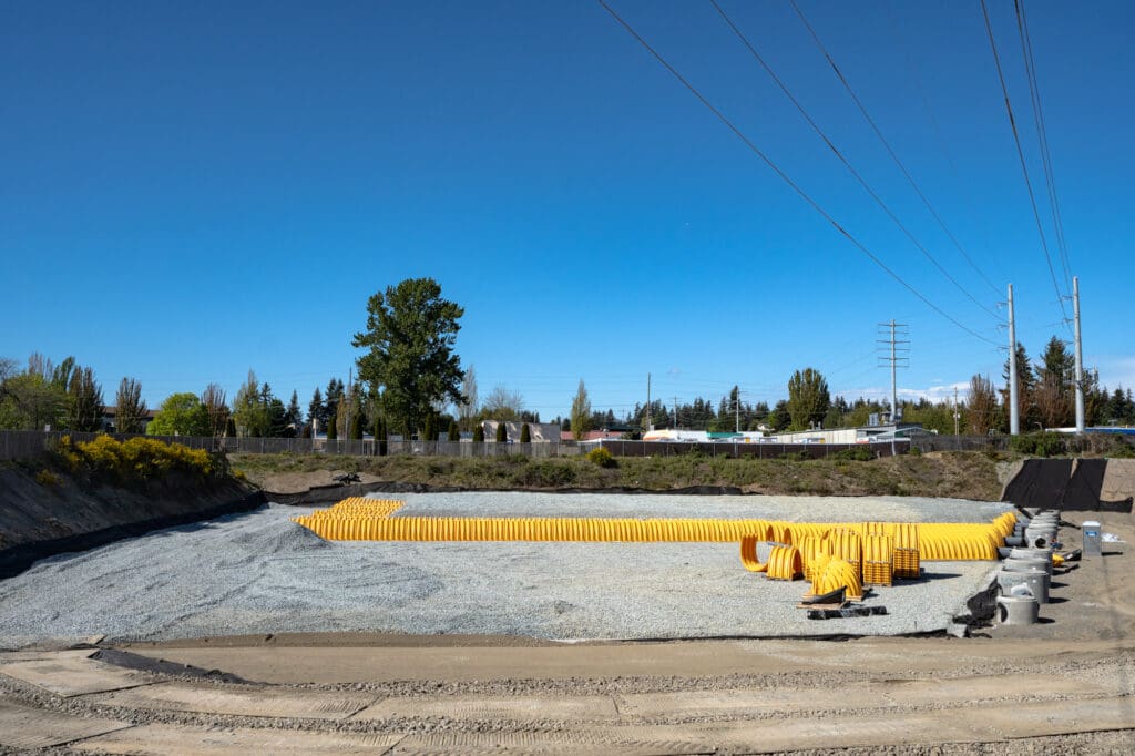 gravel surrounds long stretches of tubes called infiltration chambers