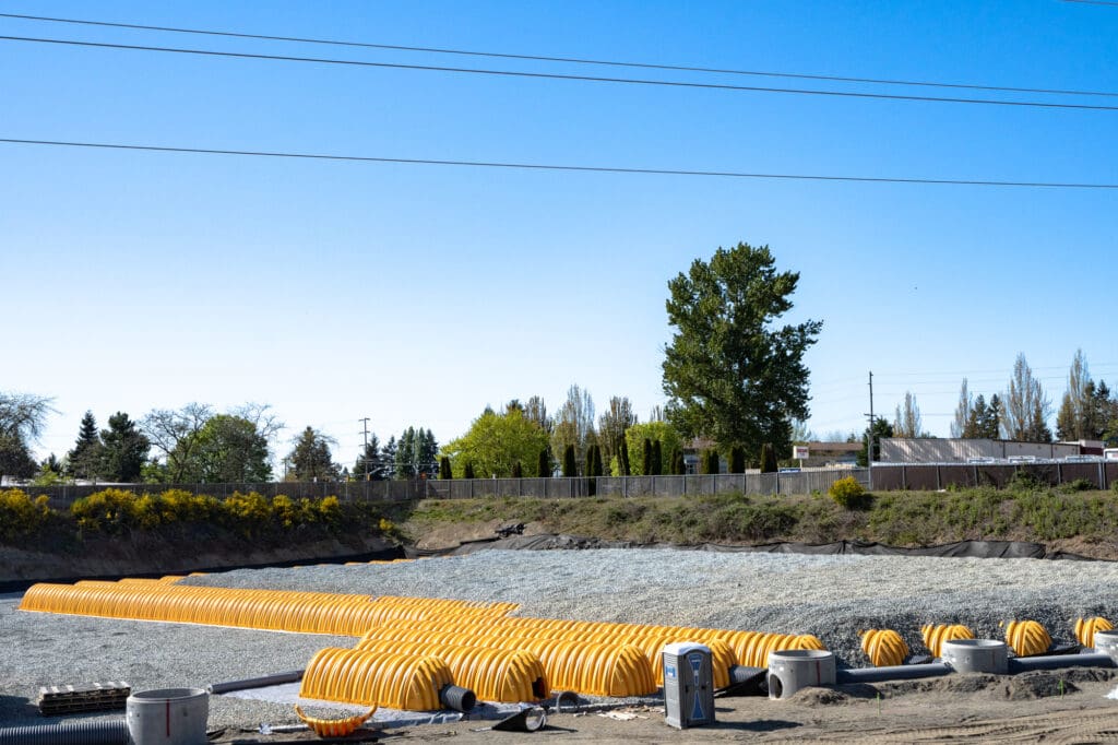 gravel surrounds long stretches of tubes called infiltration chambers