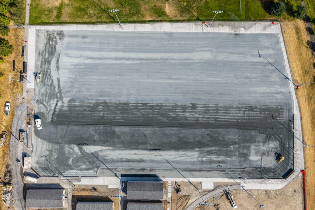 An aerial view shows a field base made up of gravel.